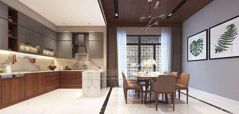 Sắp xếp nội thất phòng bếp liền phòng ăn sang trọng, độc đáo với nội thất gỗ chủ đạo từ tủ bếp, bộ bàn ghế, tường ốp gỗ tại biệt thự, nhà phố Vinh, Nghệ An.
